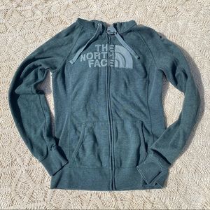 The North Face zip up green jacket.